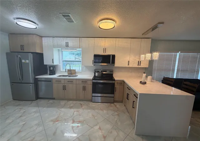 Photo 3 of Single family home for sale at 10909 W Elbow Dr, Tampa, FL 33612 | MLS# TB8546138 | Listing updated on 2026-09-12