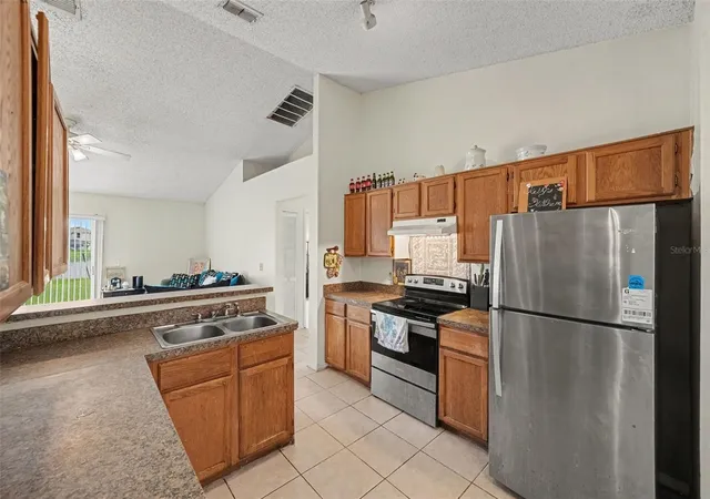 Photo 2 of Single family home for sale at 14807 Day Lily Ct, Orlando, FL 32824 | MLS# O6439851 | Listing updated on 2026-09-11