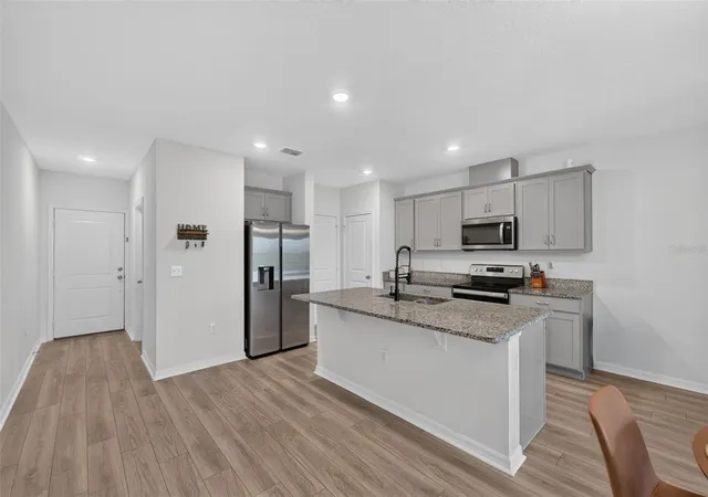 Photo 2 of Townhouse for sale at 1405 Mirabella Cir, Davenport, FL 33897 | MLS# O6439958 | Listing updated on 2026-10-08