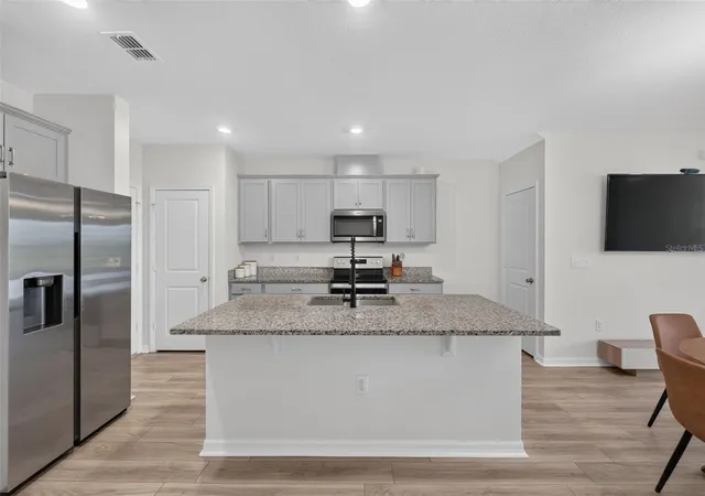 Photo 3 of Townhouse for sale at 1405 Mirabella Cir, Davenport, FL 33897 | MLS# O6439958 | Listing updated on 2026-10-08