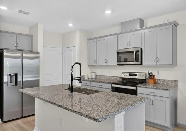 Photo 3 of Townhouse for sale at 1405 Mirabella Cir, Davenport, FL 33897 | MLS# O6439958 | Listing updated on 2026-10-08