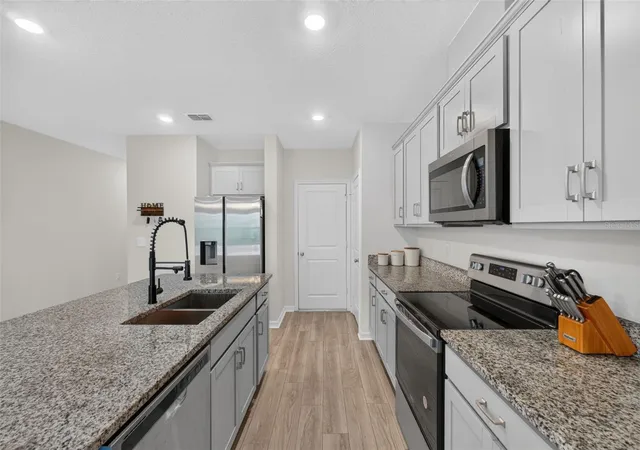 Photo 4 of Townhouse for sale at 1405 Mirabella Cir, Davenport, FL 33897 | MLS# O6439958 | Listing updated on 2026-10-08