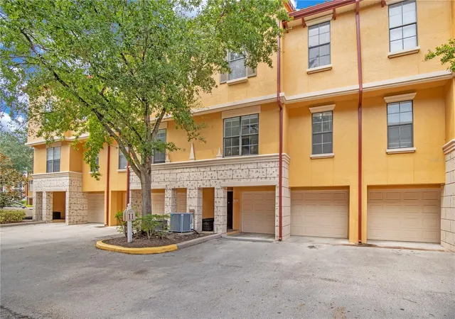 Photo 1 of Townhouse for sale at 6119 Metrowest Blvd #103, Orlando, FL 32835 | MLS# O6440211 | Listing updated on 2026-10-18