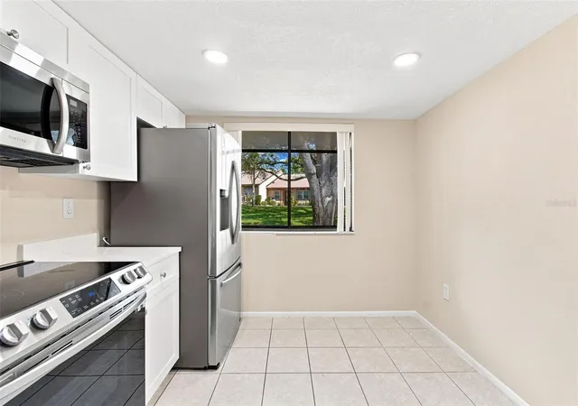 Listing Photo 5 - Condo for sale in building located at 11231 Dollar Lake Dr, Port Richey, FL 34668 - Unit #4