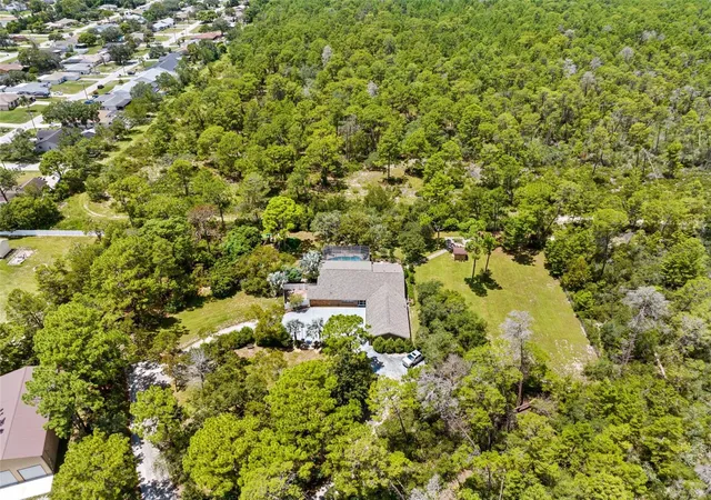 Photo 3 of Single family home for sale at 12348 Talpa St, Spring Hill, FL 34608 | MLS# W7889335 | Listing updated on 2026-09-11