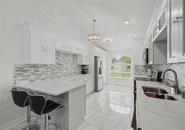 Photo 3 of Single family home for sale at 212 Arbor Woods Cir, Oldsmar, FL 34677 | MLS# TB8546900 | Listing updated on 2026-09-24
