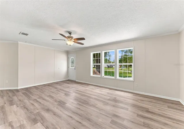 Photo 3 of Manufactured home for sale at 6453 Mangrove Dr, Wesley Chapel, FL 33544 | MLS# W7889354 | Listing updated on 2026-10-09