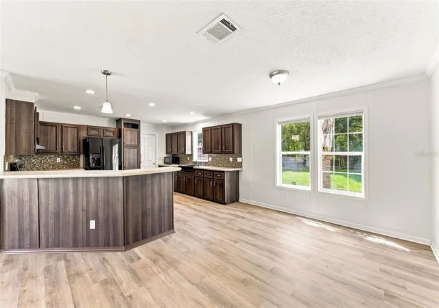 Photo 4 of Manufactured home for sale at 6453 Mangrove Dr, Wesley Chapel, FL 33544 | MLS# W7889354 | Listing updated on 2026-10-09
