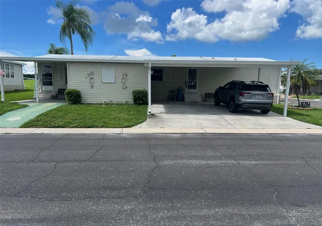 Photo 1 of Manufactured home for sale at 1 Thatch Palm St W, Largo, FL 33770 | MLS# TB8547179 | Listing updated on 2026-09-11