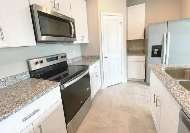 Photo 3 of Townhouse for sale at 1648 Lindley St, Mangonia Park, FL 33407 | MLS# O6440635 | Listing updated on 2026-09-12