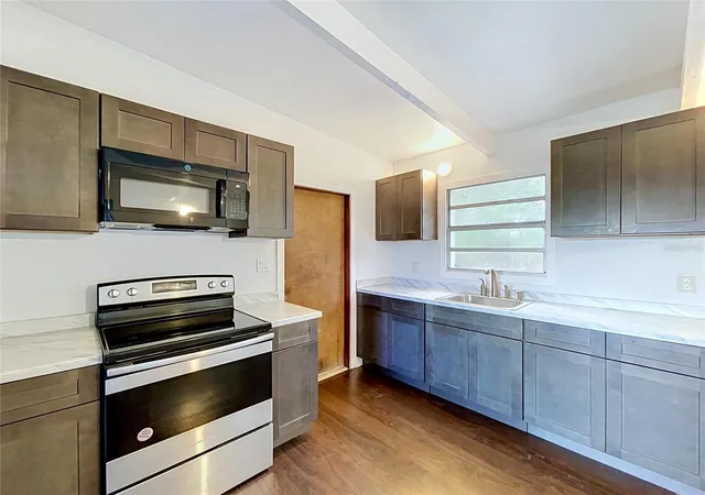 Photo 2 of Single family home for sale at 1310 Warrington Way, Tampa, FL 33619 | MLS# TB8547342 | Listing updated on 2026-09-24