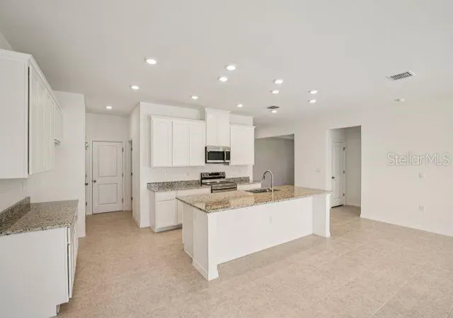 Photo 3 of Single family home for sale at 106 Lee Dr, Palm Coast, FL 32137 | MLS# O6440922 | Listing updated on 2026-09-11