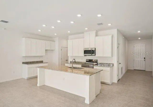 Photo 3 of Single family home for sale at 106 Lee Dr, Palm Coast, FL 32137 | MLS# O6440922 | Listing updated on 2026-09-11