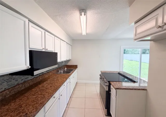 Photo 2 of Single family home for sale at 1336 Nadine Dr, Deltona, FL 32738 | MLS# O6441273 | Listing updated on 2026-10-08